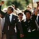 FILE - In this Feb. 11, 1990 file photo, Nelson Mandela, left, and his wife Winnie, raise clenched fists as they walk hand-in-hand from the Victor Verster prison near Cape Town, South Africa. South Africans are marking the anniversary of the release of the country's first black president, Nelson Mandela, who was freed 25 years ago. Mandela was released on Feb. 11, 1990, after 27 years in prison. (AP Photo/Greg English, File)